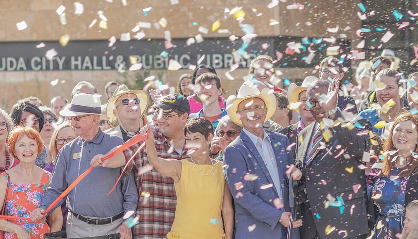 City of Buda officials and staff cut the ribbon at the grand opening festivities. -