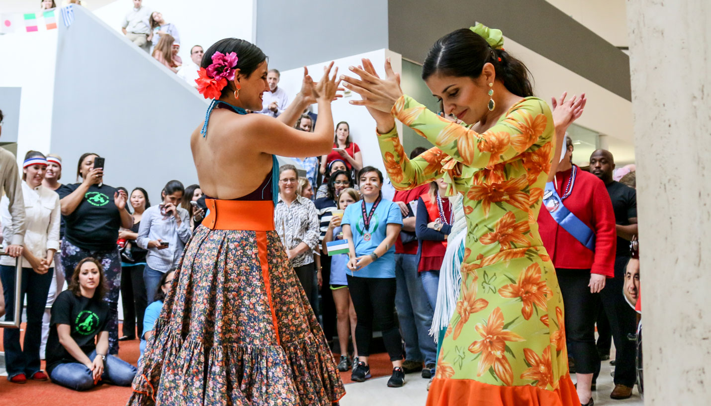 Page Designer Yvette Herrera Durán (left) performed the opening ceremonies with accompaniment. - Andy Phan