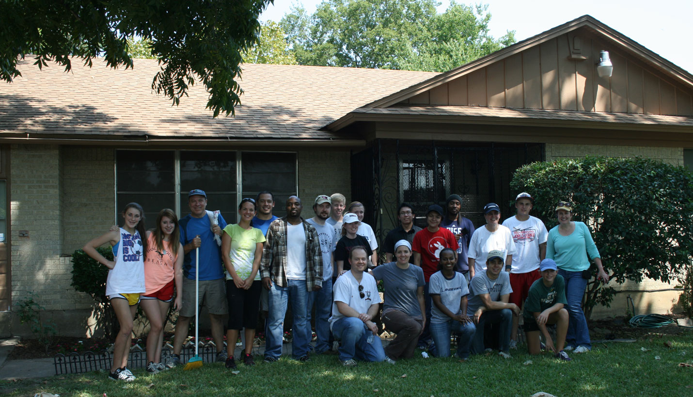 The Page team poses in front of the completed 2012 Hearts and Hammers home. -