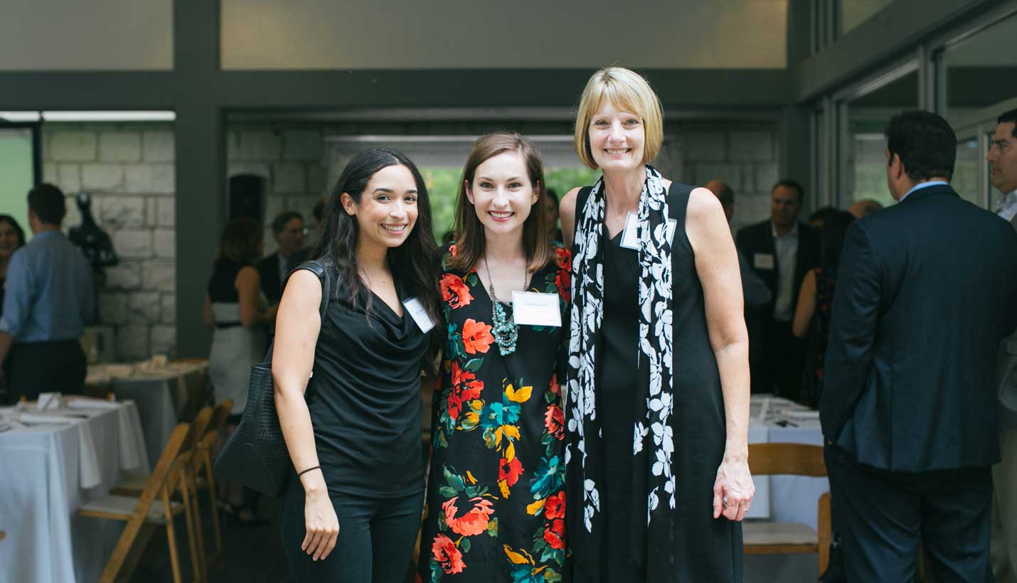 Conversations in the Garden Co-founder Karen Fassetta (center) with Hospice Austin Executive Director Marjorie Mulanax (right). -