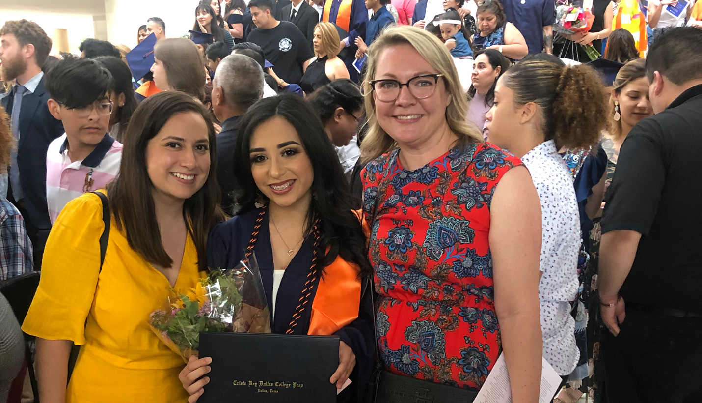 Kate Calvo graduated from Cristo Rey Dallas College Preparatory this spring after working with us for two years as an intern. She is pictured with Pagers Julie Losoya (left) and Alana Liane (right) after the graduation ceremony. -