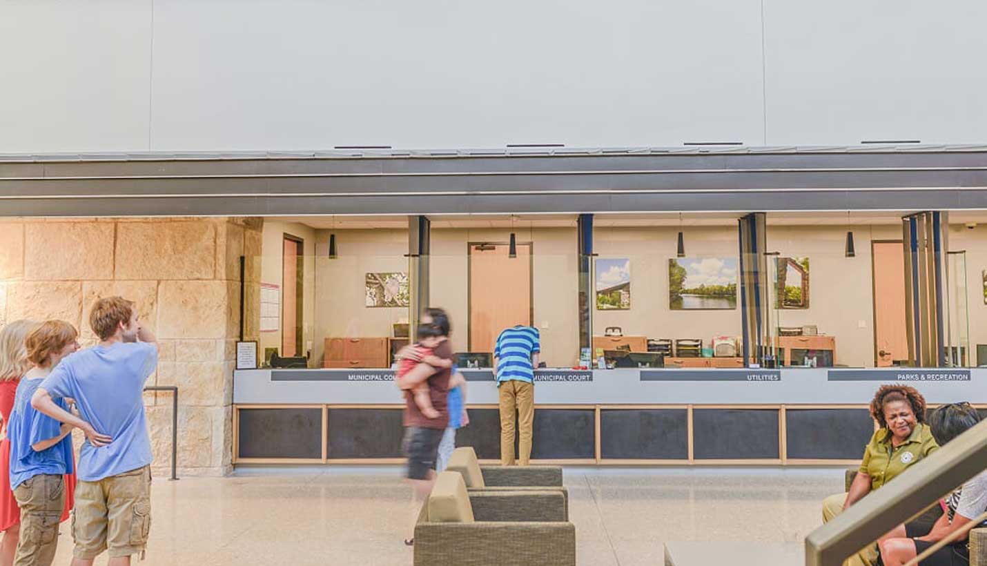 People checkout the storefront-like kiosks where they can rent parks and city facilities or pay utility bills. -