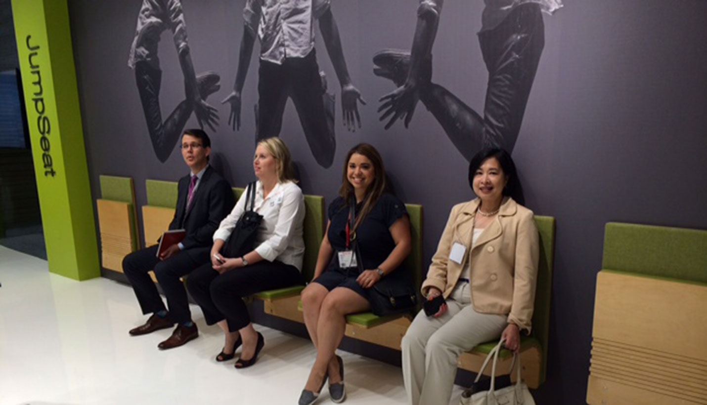 Page Interiors team members David Euscher, Stephanie Gibson, Angela Cantu and Marissa Yu test space-saving jumpseats offered by Sedia Systems. -